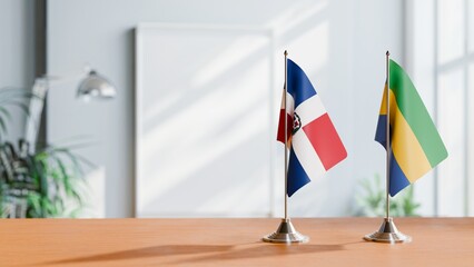 FLAGS OF DOMINICAN REPUBLIC AND GABON ON TABLE