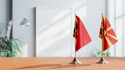 FLAGS OF EAST TIMOR AND MACEDONIA ON TABLE