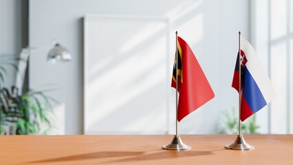 FLAGS OF EAST TIMOR AND SLOVAKIA ON TABLE