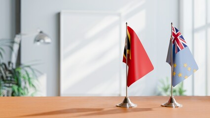 FLAGS OF EAST TIMOR AND TUVALU ON TABLE