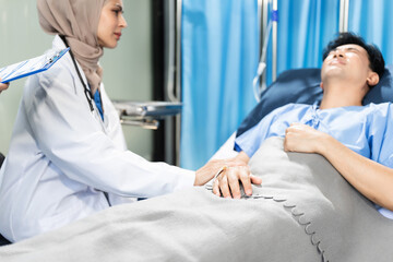 Fototapeta premium doctor talking with man patient for monitoring and check up after surgery. doctor touching patient hand and consoling.