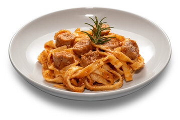 Tagliatelle egg pasta with red tomato sauce with sausage pieces and rosemary sprig in white plate isolated