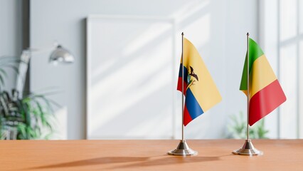 FLAGS OF ECUADOR AND MALI ON TABLE