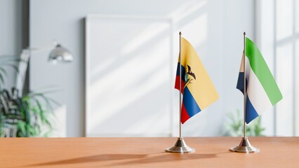 FLAGS OF ECUADOR AND SIERRA LEONE ON TABLE