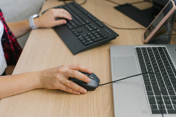 Office Workday: Woman Using Computer Mouse Next to Laptop