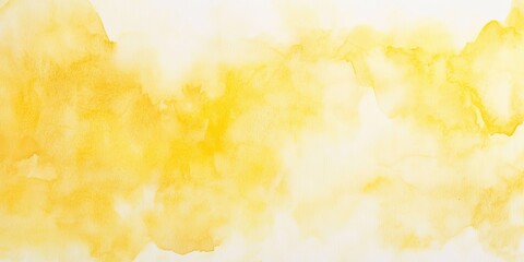 Abstract yellow watercolor background with soft, flowing clouds.