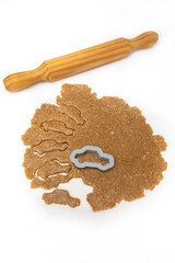 Cutting car-shaped cookies from homemade oatmeal dough