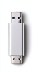 A sleek silver USB flash drive isolated on a clean background, perfect for data storage and transfer.