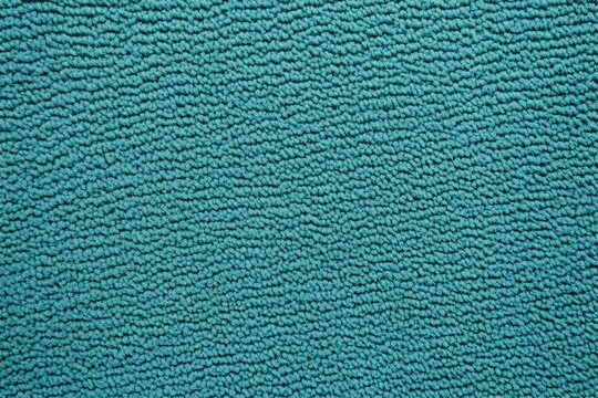 Soft plush teal background with a cozy boucle like textured surface  Warm fuzzy and inviting abstract pattern for home decor product photography or clean minimalist designs