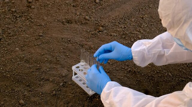 Taking soil samples in nature. Selective focus.