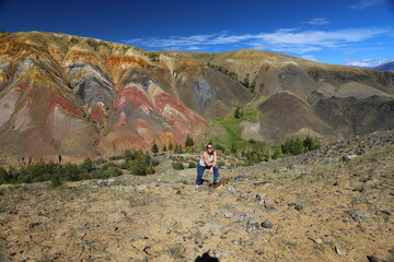 Altai Republic. Tourists pose against the background of Martian and Moon landscapes &ndash; deserted area with canyons.