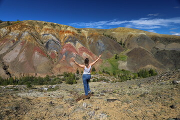 Naklejka premium Altai Republic. Tourists pose against the background of Martian and Moon landscapes – deserted area with canyons.