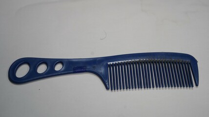 Blue hair comb on white background