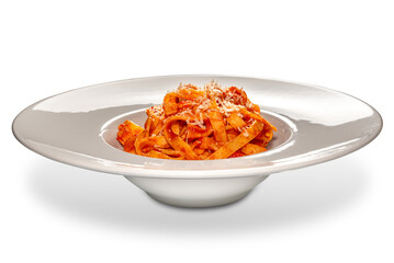 Tagliatelle noodles pasta with red tomato sauce with grated parmesan cheese in white plate isolated