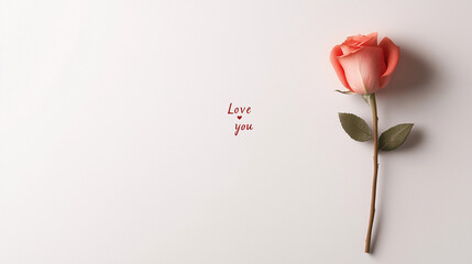 Fototapeta premium Single pink rose with a love you message.