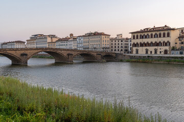 Fototapeta premium Sunrise on Arno River and Carraia Bridge. Florence, Tuscany 