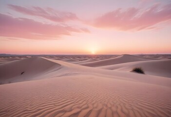 A large pink sun setting over dark sand dunes in a desert landscape