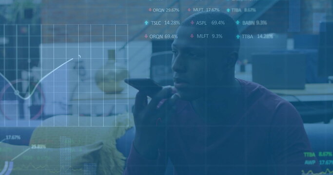 Image of financial data processing over african american businessman using smartphone