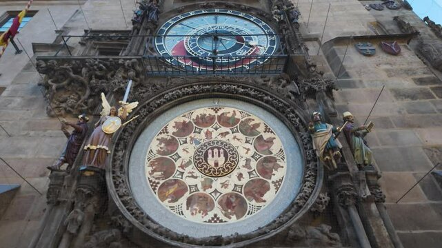 Tilt up along Prague's Astronomical Clock Tower, showcasing intricate medieval design and clock face details