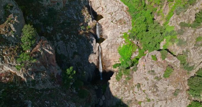 Tilt down reveal shot of tripple waterfall in Sardinia, Italy