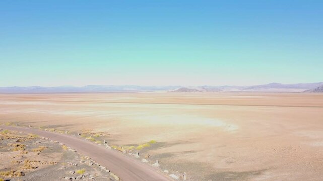 Drone across Nevada dry lake bed on a sunny summer day