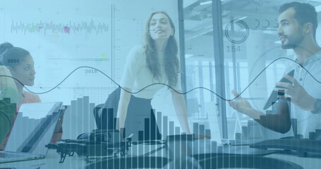 Image of financial data processing over diverse colleagues discussing work in office