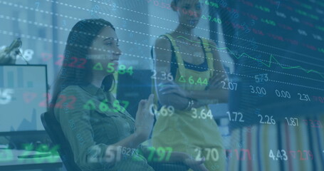 Image of financial data processing over diverse colleagues discussing work in office