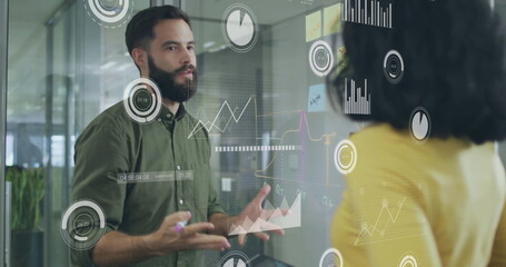 Image of financial data processing over diverse colleagues discussing work in office