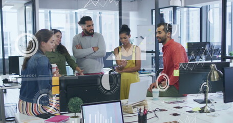 Image of financial data processing over diverse colleagues discussing work in office