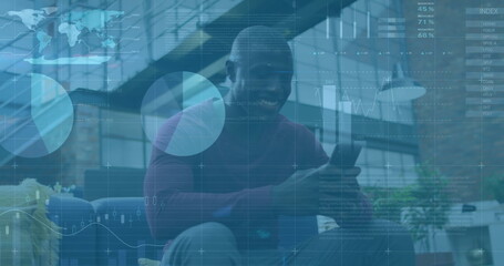 Image of financial data processing over african american businessman using smartphone
