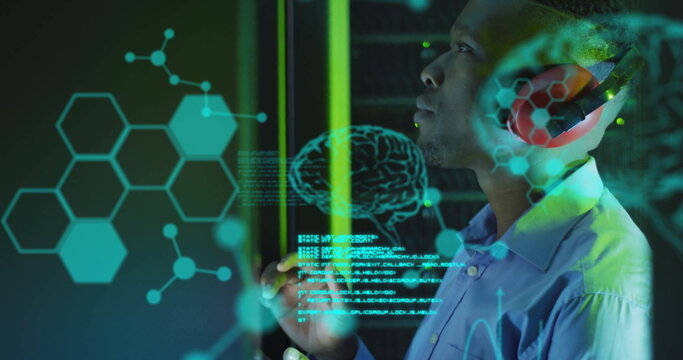 Image of data processing with brains over african american businessman in server room - Powered by Adobe