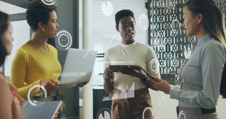 Image of financial data processing over diverse colleagues discussing work in office