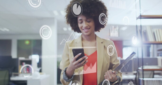 Image of data processing over african american businesswoman using smartphone in office