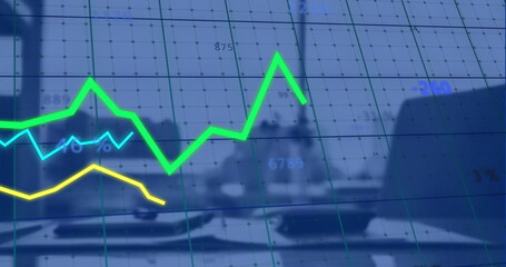 Image of financial data processing over desk in office