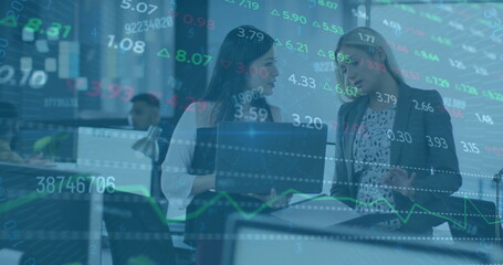 Image of financial data processing over diverse colleagues discussing work in office