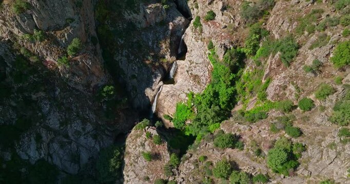 Tilt pan shot of tripple waterfall in Sardinia, Italy