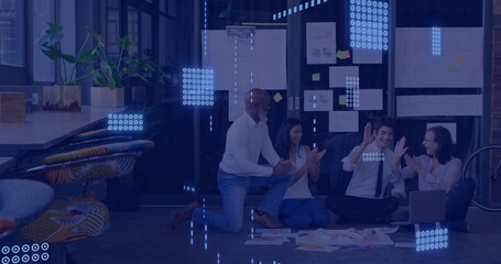 Data processing image over diverse team collaborating on floor in modern office