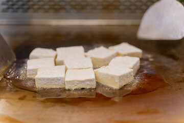 The fragrant Teppanyaki tofu is being prepared for each dish