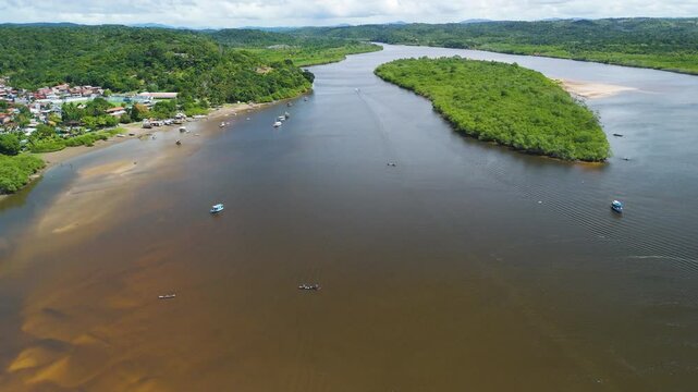 Drone shot of traditional fishing boat on the De Contas river in sunny Brazil