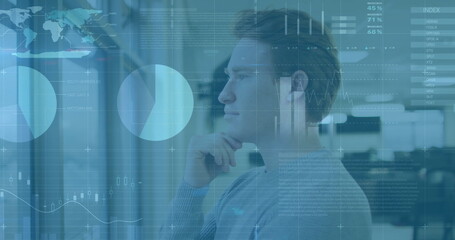 Image of financial data processing over caucasian businessman in office