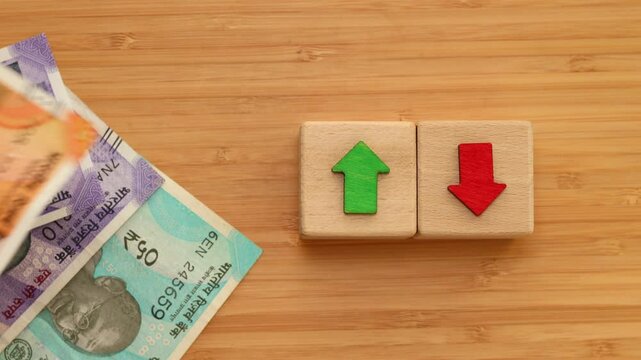 India, Financial Market, Economic analysis, interest rates, stocks, bonds, ranking, household budget, mortgage, loan rates, Percent, up or down, arrow symbol, counting Indian Rupees money, close up