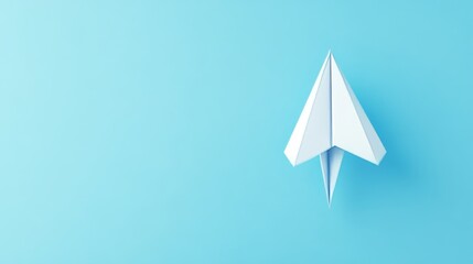 A simple paper airplane set against a blue backdrop, representing lightness, creativity, and the spirit of adventure and innovation.