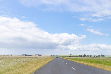 Long Open Highway Stretching Across Peaceful Countryside