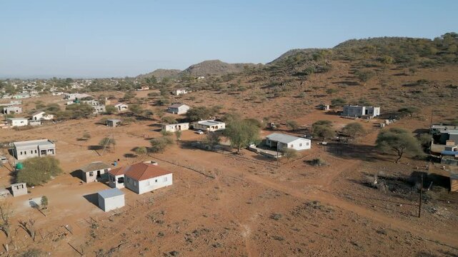 aerial view african village , typical Southern african rural area, mountain range and hills, village Botswana, South Africa