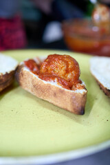 A hearty sandwich made with a pizza dough base, baked to perfection and filled with two perfectly assembled meatballs