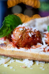 A hearty sandwich made with a pizza dough base, baked to perfection and filled with two perfectly assembled meatballs