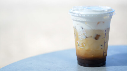 Langkawi, Malaysia: Oktober 2nd, 2024 : The ZUS Coffee logo is prominently displayed on the side of the cup, indicating the brand.