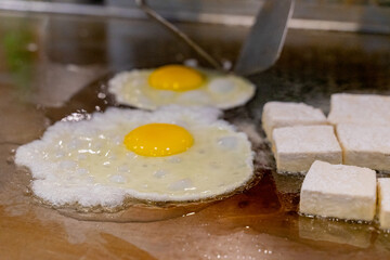 The fragrant Teppanyaki tofu is being prepared for each dish