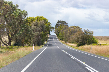 Long Open Highway Stretching Across Peaceful Countryside