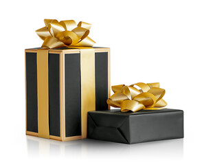 two black boxes with gold bows are isolated on a white background with reflection and shadow.